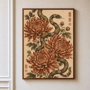 May include: A framed wall art print featuring a winding dark green and gold patterned snake weaving through three large, detailed rust-orange chrysanthemum flowers and green foliage on a cream background with red rectangular stamps.