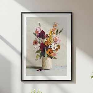 May include: A framed oil painting featuring a textured impasto bouquet of flowers in shades of deep burgundy, vibrant yellow, soft pink, and white, arranged in a light-colored vase against a neutral, off-white background with visible brushstrokes.