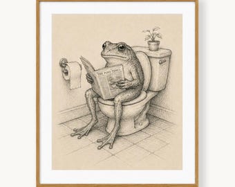 May include: A black and white pencil drawing of a frog sitting on a toilet, reading a newspaper titled The Pond Times. A toilet paper roll is mounted on the wall to the left, and a small potted plant sits on the toilet tank in this framed art.