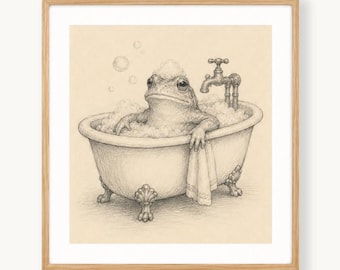 May include: A graphite-style illustration of a frog sitting in a claw-foot bathtub filled with bubbles. A metal faucet is attached to the tub, and a small towel hangs over the side. The artwork is presented within a light-colored wooden frame.