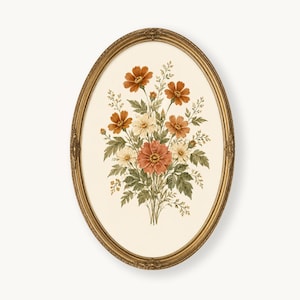 May include: An oval wall art piece featuring a botanical illustration of a flower bouquet with rust, orange, and cream-colored blossoms and green leaves. The artwork is encased in an ornate, metallic gold-toned frame with decorative detailing.