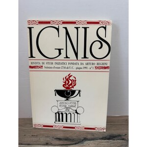 May include: A softcover book titled IGNIS, Rivista di Studi Iniziatici fondata da Arturo Reghini, Solstizio d'estate 2744 ab U.C. - giugno 1991 - n°1. The cover is white with black text and a red flame graphic above a pedestal with the text Agnosco Veteris Vestigia Flammae Ara.