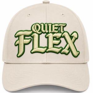 May include: A beige baseball cap featuring the text QUIET FLEX embroidered on the front in a raised, metallic gold font with a dark green outline. The cap has a structured crown, a curved brim, and stitched eyelets on the upper panels.