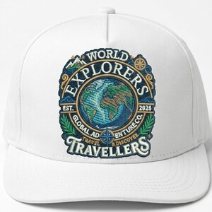 May include: A white baseball cap featuring a central embroidered emblem with a globe, mountain, and compass design. The text reads WORLD EXPLORERS, GLOBAL ADVENTURE CO., EST. 2026, TRAVEL & DISCOVER, and TRAVELLERS in blue, green, and gold thread.