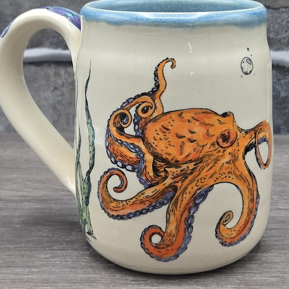 Orange octopus mug, 15 oz. dishwasher and microwave safe.