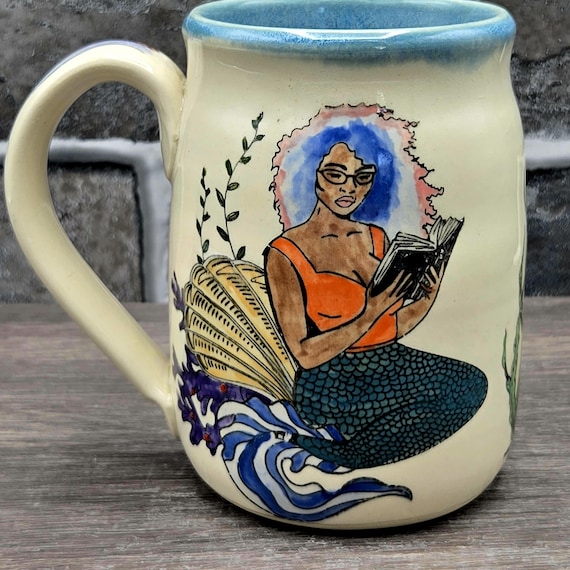 Mermaids reading mug, large mug