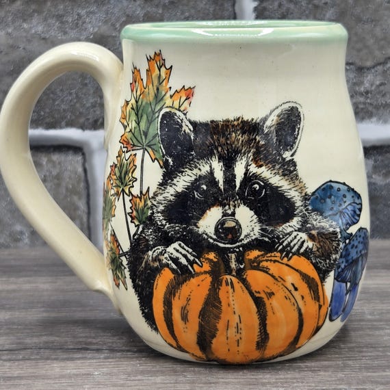 Raccoons in the pumpkin patch mug, 14 oz. Green inside glaze