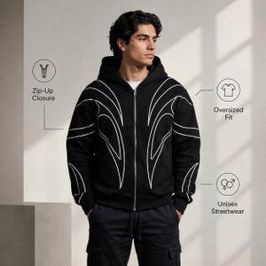 May include: A black zip-up hoodie featuring white line art patterns across the chest and sleeves. The garment includes a silver-tone zipper, a hood, and long sleeves. Text labels on the image indicate Zip-Up Closure, Oversized Fit, and Unisex Streetwear.