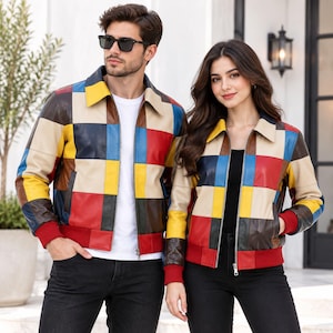 May include: A leather bomber jacket featuring a multi-colored patchwork design in red, yellow, blue, and beige squares. The jacket includes a classic collar, a front zipper closure, and solid red ribbed knit cuffs and hem at the waist.