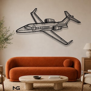 May include: A black metal wall art piece shaped like a private jet airplane. The design features a sleek fuselage, two jet engines mounted on the rear, and wings with winglets. The silhouette is rendered in a clean, linear style.