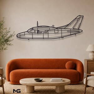 May include: A black metal wall art piece shaped like the side profile of a propeller airplane. The design features a minimalist wireframe outline of the aircraft, including the cockpit, wings, tail section, and a single propeller at the front.