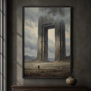 May include: A framed wall art print depicting a vast, desolate landscape under a cloudy sky. A lone figure stands before a massive, ancient stone archway covered in weathered carvings. The scene features muted earth tones, gray clouds, and shadows.