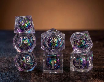 May include: A set of polyhedral dice made of clear resin, each containing a swirling core of iridescent purple, blue, and green glitter. The dice feature silver-colored numbers engraved on their surfaces, including a d20, d12, d10, d8, d6, and d4.