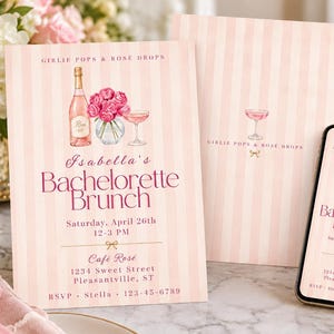 May include: A bachelorette brunch invitation card and a smartphone displaying the same design. Both feature a light pink striped background, a watercolour illustration of a rose wine bottle, pink flowers, and a glass, with the text Isabella's Bachelorette Brunch, Saturday, April 26th, 12-3 PM, Café Rosé, 1234 Sweet Street, Pleasantville, ST, and RSVP Stella 123-45-6789.