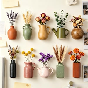 May include: A collection of ten wall-mounted ceramic vases in various shapes and colours, each holding a different dried floral arrangement including lavender, wheat, roses, eucalyptus, pampas grass, and marigolds, displayed on a light surface.