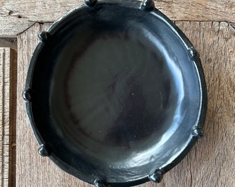 Small organic round serving bowl, black, with raised blobbles on rim