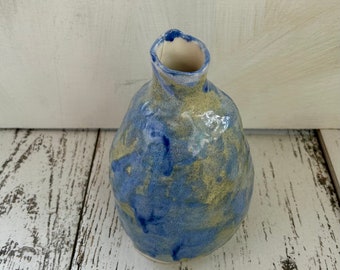 small stubby mottled blue and ecru vase