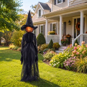 May include: A tall, standing witch decoration featuring a black pointed hat and a long, flowing black gown. The head is a glowing, orange, textured pumpkin-like sphere that emits a warm light, positioned atop a dark, draped fabric body.