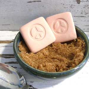 May include: A set of three ceramic mugs with a speckled, matte finish. The mugs are in shades of cream, light gray, and dark gray. Each mug has a simple, minimalist design and a rounded handle. Perfect for coffee or tea.