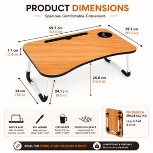 May include: A portable laptop desk with a light wood grain surface, black trim, and white foldable legs. It features a device slot, a cup holder, and dimensions of 23.5 inches by 15.5 inches by 10.5 inches high. The desk is shown in both open and folded positions.