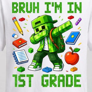 May include: A white short-sleeve t-shirt featuring a graphic of a green pixelated character dabbing, surrounded by school supplies like a pencil, books, and an apple. The text reads BRUH I'M IN 1ST GRADE in green pixelated block letters.
