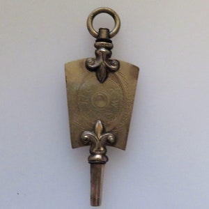 Victorian 1900 Era Fleur-de-lis (Fleur De Lis) Ornate Pocket Watch Key Size 7, Pendant, Fob