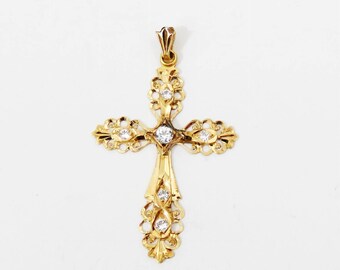 Colgante de cruz de oro macizo de 18 quilates con espinelas brillantes.