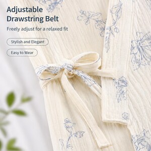 May include: A cream-colored robe with a blue floral print featuring an adjustable drawstring belt. The text on the image reads: Adjustable Drawstring Belt, Freely adjust for a relaxed fit, Stylish and Elegant, Easy to Wear.