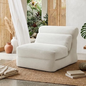 May include: A low-profile armless chair upholstered in white corduroy fabric with a distinct horizontal ribbed texture. The chair features a rounded backrest and a thick, cushioned seat, creating a singular, cohesive piece of furniture.