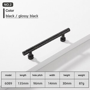 May include: A glossy black cabinet handle with a textured, hammered surface. The handle is model 6089, measuring 135mm in length, 14mm in width, and 30mm in height, with a 96mm hole pitch and a weight of 87g. The text NO.2 and black / glossy black appear.