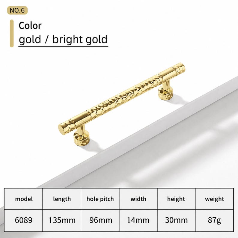 May include: A bright gold cabinet handle with a textured, hammered surface. The handle is model 6089, measuring 135mm in length, 96mm hole pitch, 14mm width, 30mm height, and weighing 87g. The text NO.6 and Color gold / bright gold are visible.