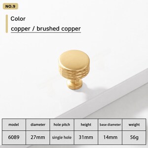 May include: A brushed copper cabinet knob, model 6089, with a round top and textured sides. The knob has a 27mm diameter, 31mm height, 14mm base diameter, and weighs 56g. It features a single hole installation design for furniture or cabinetry.