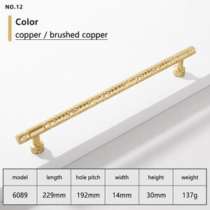 May include: A brushed copper cabinet handle with a textured, hammered surface. The handle is model 6089, measuring 229mm in length, 14mm in width, and 30mm in height, with a 192mm hole pitch and a weight of 137g. The text NO.12 is visible.
