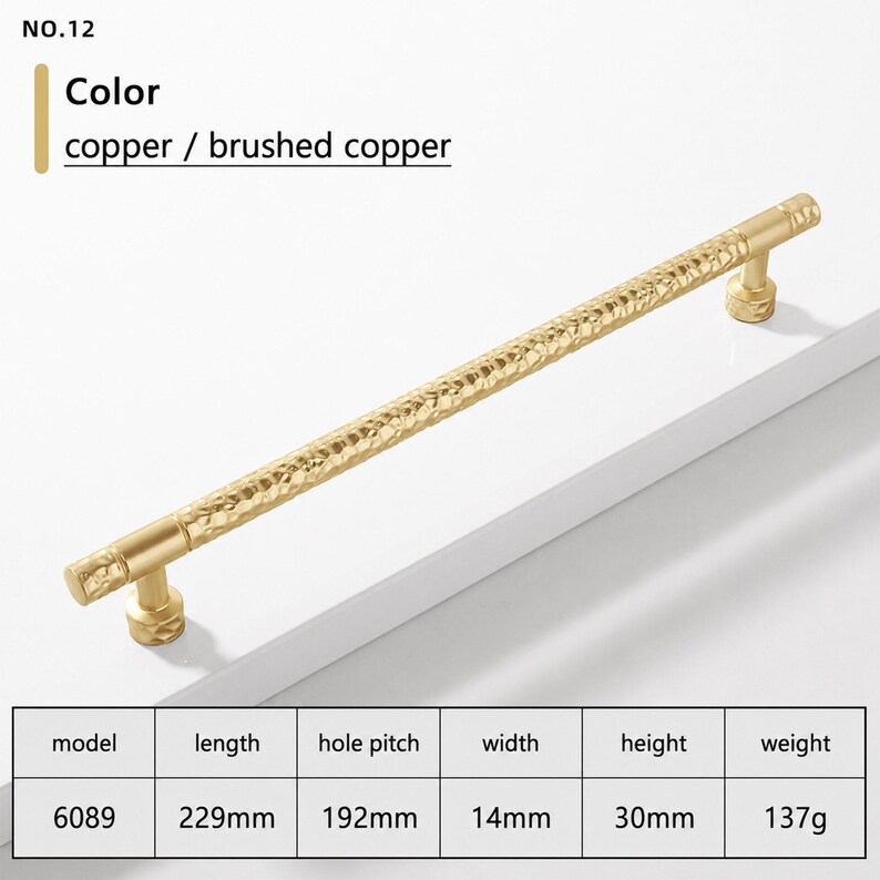 May include: A brushed copper cabinet handle with a textured, hammered surface. The handle is model 6089, measuring 229mm in length, 14mm in width, and 30mm in height, with a 192mm hole pitch and a weight of 137g. The text NO.12 is visible.
