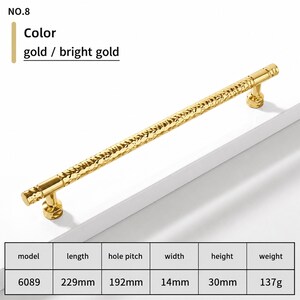 May include: A bright gold cabinet handle with a textured, hammered surface. The hardware is model 6089, measuring 229mm in length, 192mm in hole pitch, 14mm in width, and 30mm in height, with a weight of 137g. The text NO.8 is visible.
