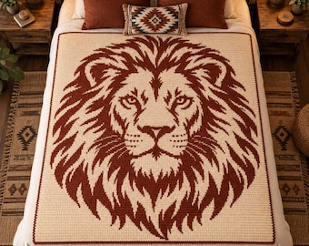 May include: A rectangular crochet blanket featuring a large, centered lion head motif in dark rust brown against a cream-colored background. The lion design is detailed with a thick, textured mane and symmetrical facial features.