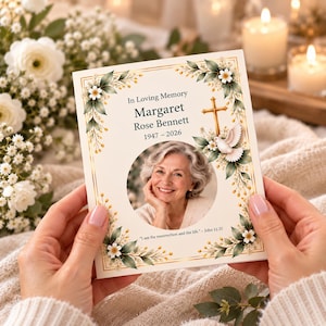 May include: A funeral programme card featuring a circular portrait of an older woman, the text In Loving Memory, Margaret Rose Bennett, 1947-2026, and John 11:25. The design includes a gold cross, a white dove, and floral borders with green leaves.