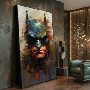 May include: A large rectangular framed wall art piece featuring an abstract, painterly portrait of Batman. The artwork uses a vibrant palette of deep blues, blacks, oranges, and yellows with visible brushstrokes and paint drips throughout the composition.