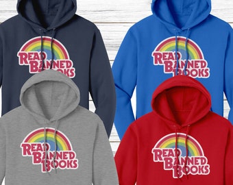May include: Four different colored hoodies with a rainbow and the text "Read Banned Books" printed on the front. The hoodies are navy blue, royal blue, heather gray, and red.