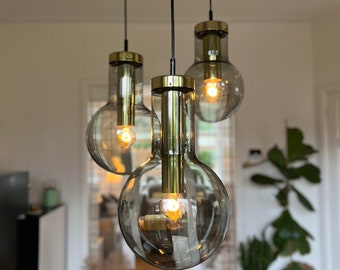 RAAK Amsterdam pendant , Chandelier of 3 glass and brass  Maxi Globe pendant lamps by Raak Amsterdam