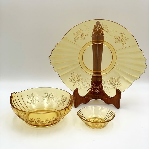 Amber colored glass lot bowls and serving tray , Amber glass with grape leaf pattern