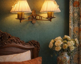 Antique art nouveau brass sconce with double light and textile shades