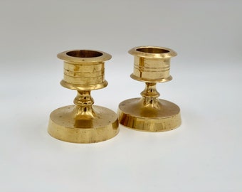 Pair of chunky brass candle holders
