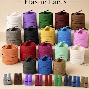 Könnte beinhalten: Eine Sammlung von aufgerollten elastischen Schnürsenkeln in verschiedenen Farben wie Weiß, Lila, Grün, Burgunderrot, Braun, Grau, Schwarz, Gelb, Blau, Pink, Orange und Rot, ergänzt durch passende rechteckige Metallverschlüsse für Schnürsenkel.