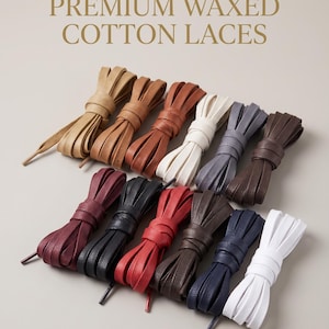 May include: A collection of twelve pairs of flat, textured shoelaces arranged in two rows. The laces are labeled PREMIUM WAXED COTTON LACES and come in various colors including tan, brown, white, gray, burgundy, black, red, and navy blue.