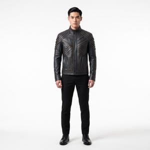 May include: A black leather jacket featuring a high mandarin collar, long sleeves, and intricate geometric paneling across the chest and shoulders with visible brown stitching. The jacket is paired with slim-fit black trousers and black leather shoes.