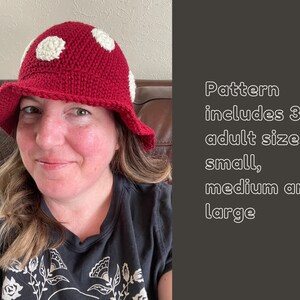 May include: A person wearing a red crocheted mushroom hat with white polka dots. The hat has a wide brim. Pattern includes 3 adult sizes: small, medium and large.