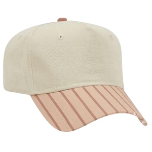 May include: A baseball cap featuring a solid cream-colored crown with a small brown button at the top center. The curved brim is a soft peach color with thin, vertical brown stripes running across the entire surface of the visor.