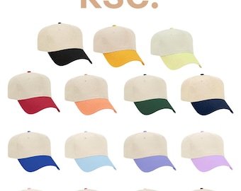May include: A collection of sixteen baseball caps arranged in a grid, each featuring a cream-coloured crown and a solid-coloured brim in various shades including black, yellow, lime, red, orange, green, navy, blue, light blue, purple, lavender, pink, hot pink, white, and brown, with the text kenz supply co ksc at the top.