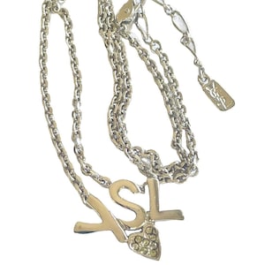 Vintage Yves Saint Laurent silver metal necklace with YSL logo and heart crystal top. 070715ac4